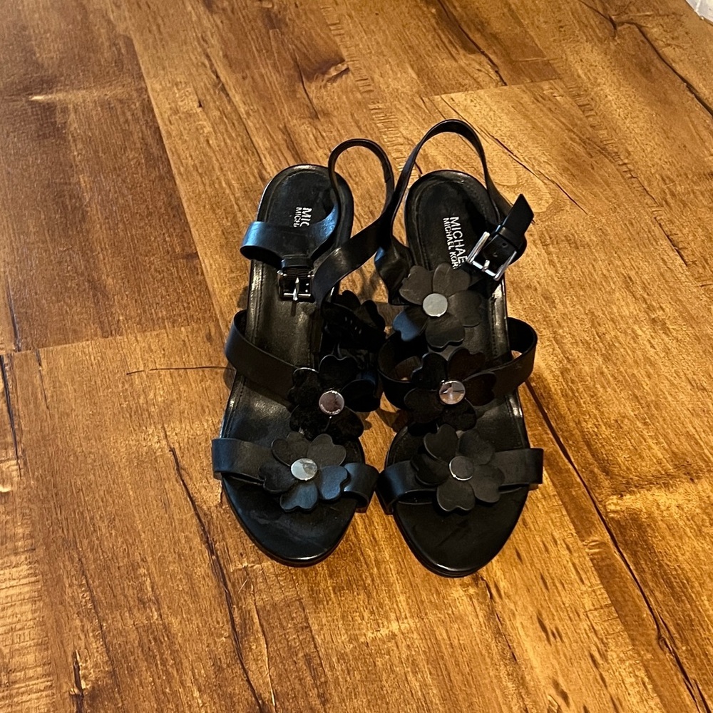 Michael Kors leather stacked heel sandal with flower detail.  Size 8 NWOT or box